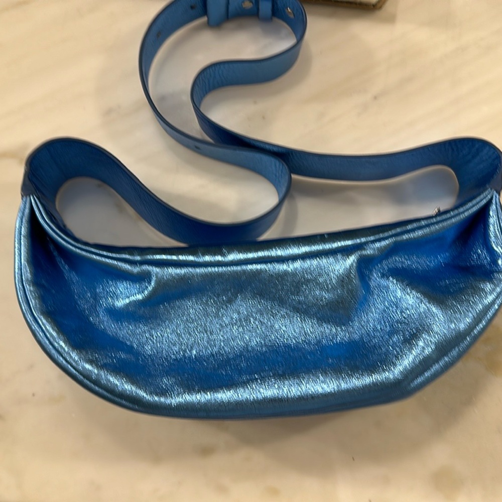 Never been worn, COS sling bag in metallic blue. No longer available.